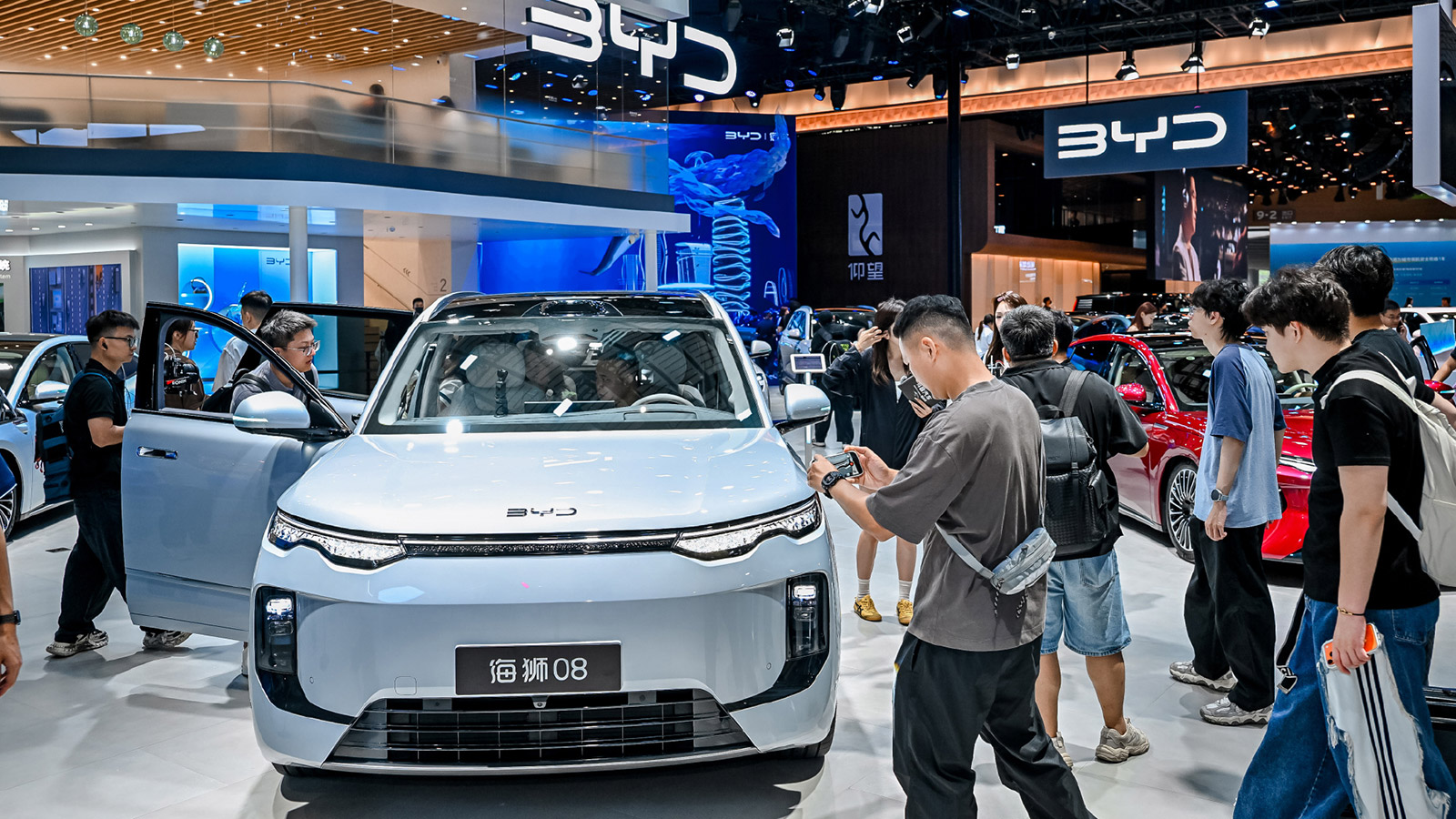 Front view of a BYD Sealion 08 surrounded by visitors at the 2026 Chengdu auto show.