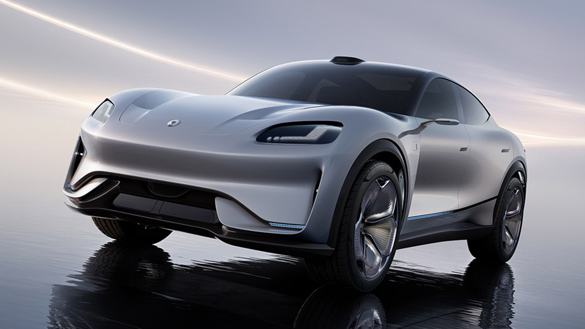 A silver Aiva Origin Concept crossover shown from the front three-quarter view, featuring a coupe-like roofline, roof-mounted LiDAR and sculpted bodywork.