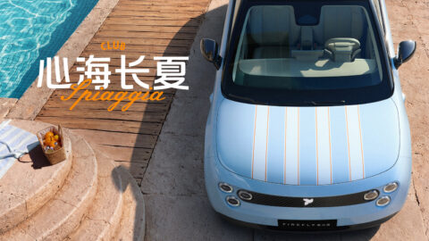 Overhead view of the light-blue Nio Firefly Club Spiaggia beside a swimming pool, showing orange stripes across the hood.