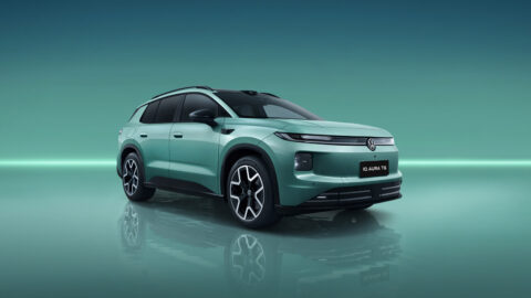 Green FAW-Volkswagen ID. AURA T6 shown from a front three-quarter angle in a studio setting.