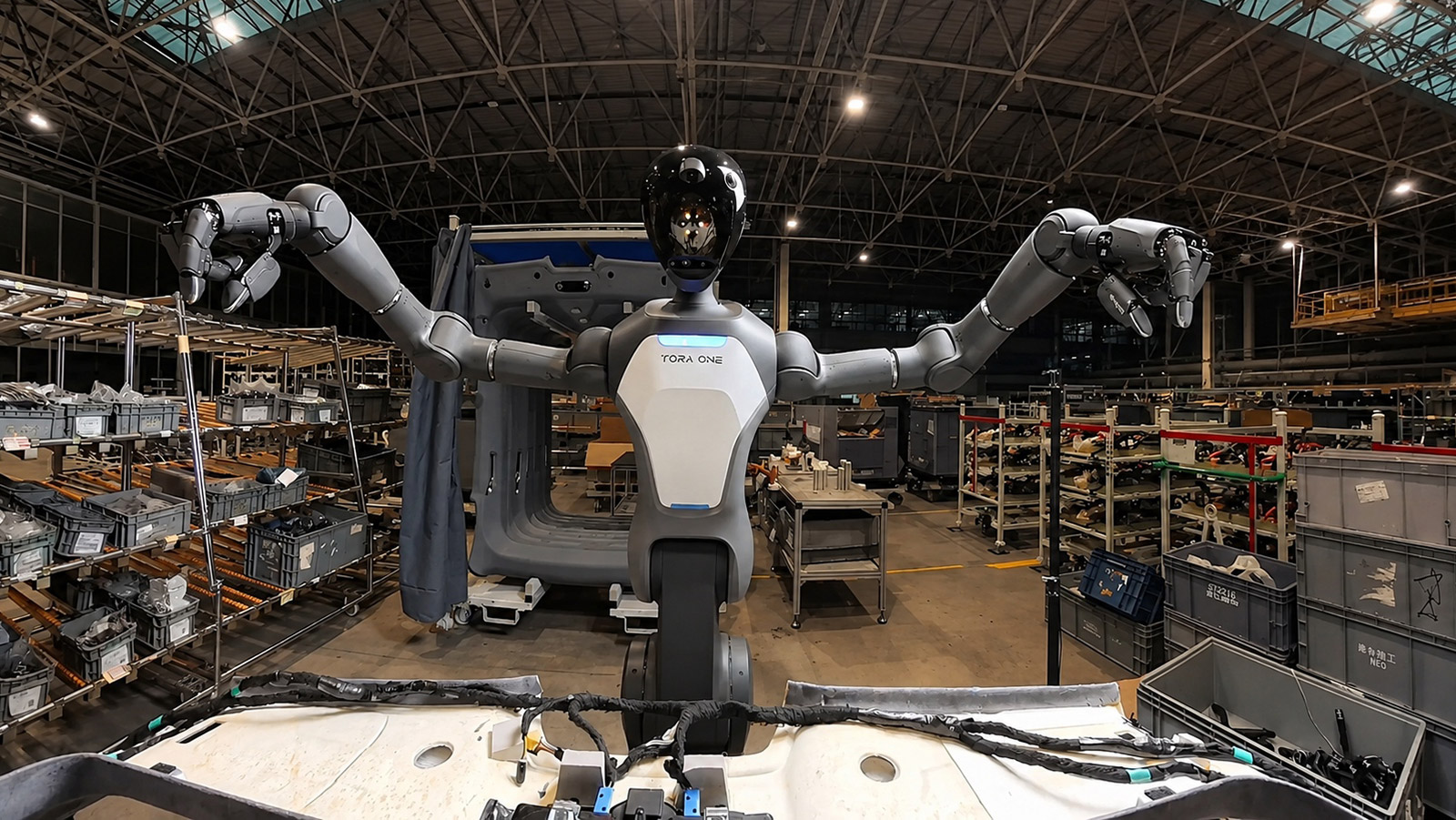 PaXini's Tora-One humanoid robot performs an automotive assembly task at Geely's Qiantang manufacturing base.