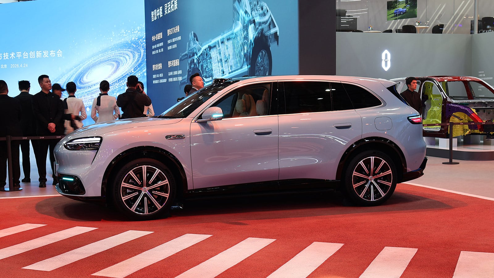 A light-blue Aito M6 SUV shown in side profile at the 2026 Beijing auto show.