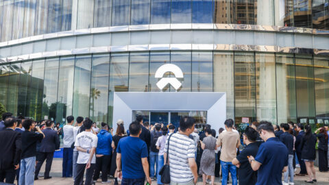 A crowd gathers outside Nio House Macau during the electric vehicle maker’s opening ceremony.