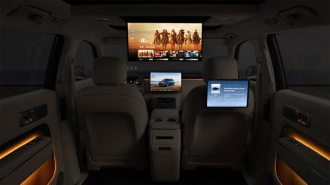 Xiaomi Sky Nomad N70 cabin viewed from the rear, with a ceiling-mounted entertainment screen, seatback tablet and ambient lighting.