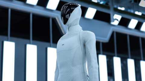 Close-up of Xpeng's Iron humanoid robot showing its black faceplate and textured white upper body.