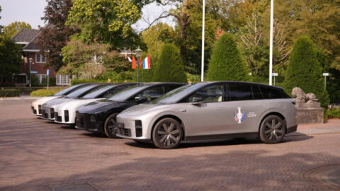 A lineup of Li i6 electric SUVs, with Solheim Cup branding on the nearest vehicle's front door.