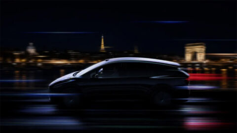 A Li i6 electric SUV shown against illuminated Paris landmarks in a nighttime promotional image.
