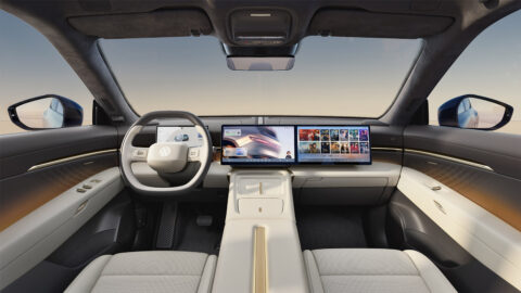 Volkswagen ID. UNYX 08 cockpit with light-colored upholstery, a digital instrument cluster and dual dashboard screens.