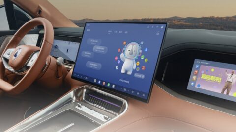 Denza N8L BEV interior featuring brown upholstery, a large central touchscreen, a digital instrument cluster and a passenger display.