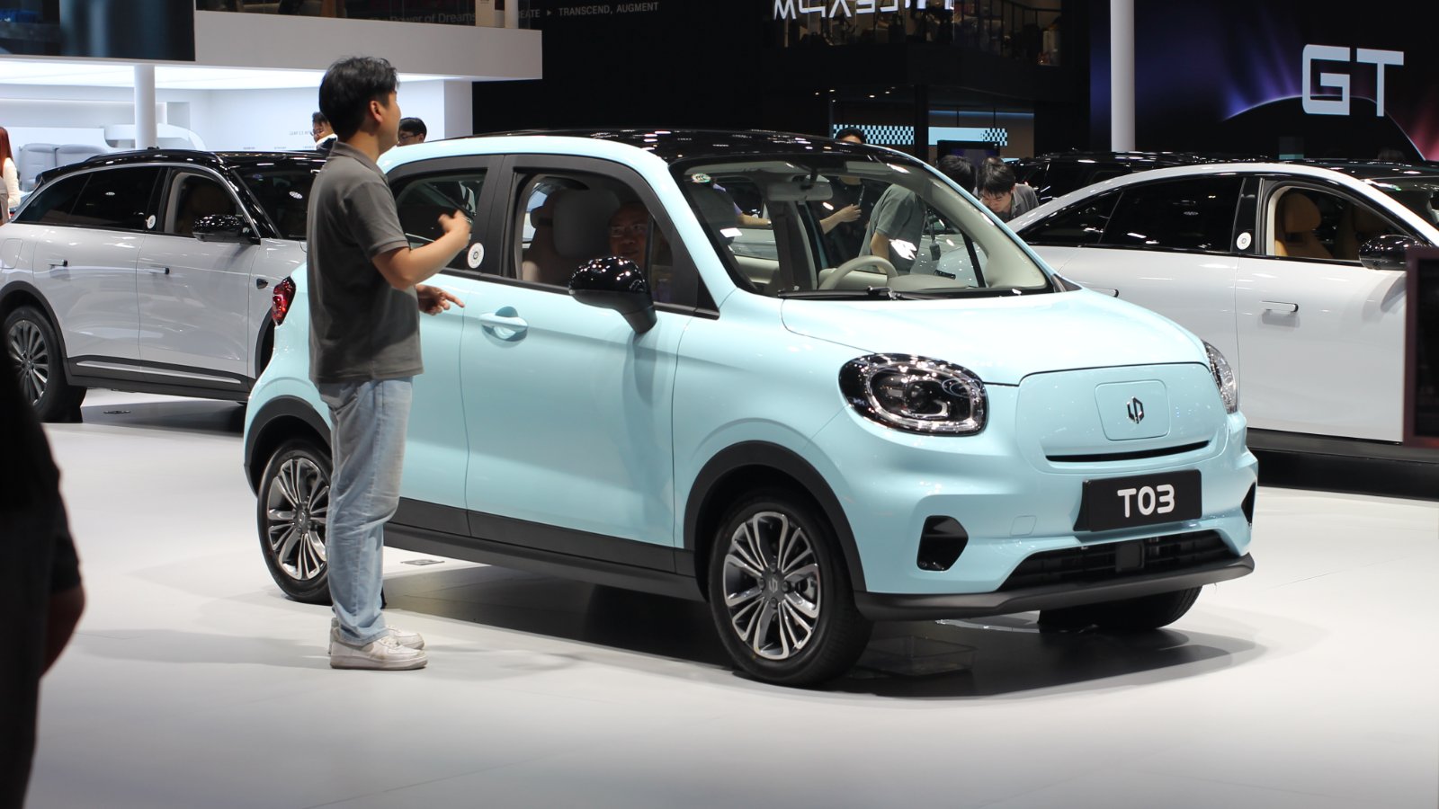 Light blue Leapmotor T03 electric hatchback with a black roof on display at the 2025 Shanghai Auto Show.