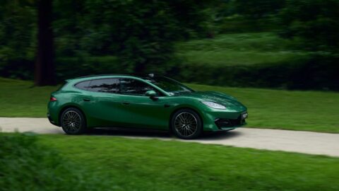 Green Fang Cheng Bao Formula S GT driving along a road through a wooded area.