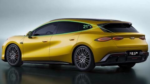 Yellow Fang Cheng Bao Formula S GT viewed from the rear three-quarter angle, showing its roof spoiler and taillights.