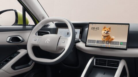 Interior of the 2027 BYD Yuan Up, showing a 2-spoke steering wheel, digital instrument display and central touchscreen.