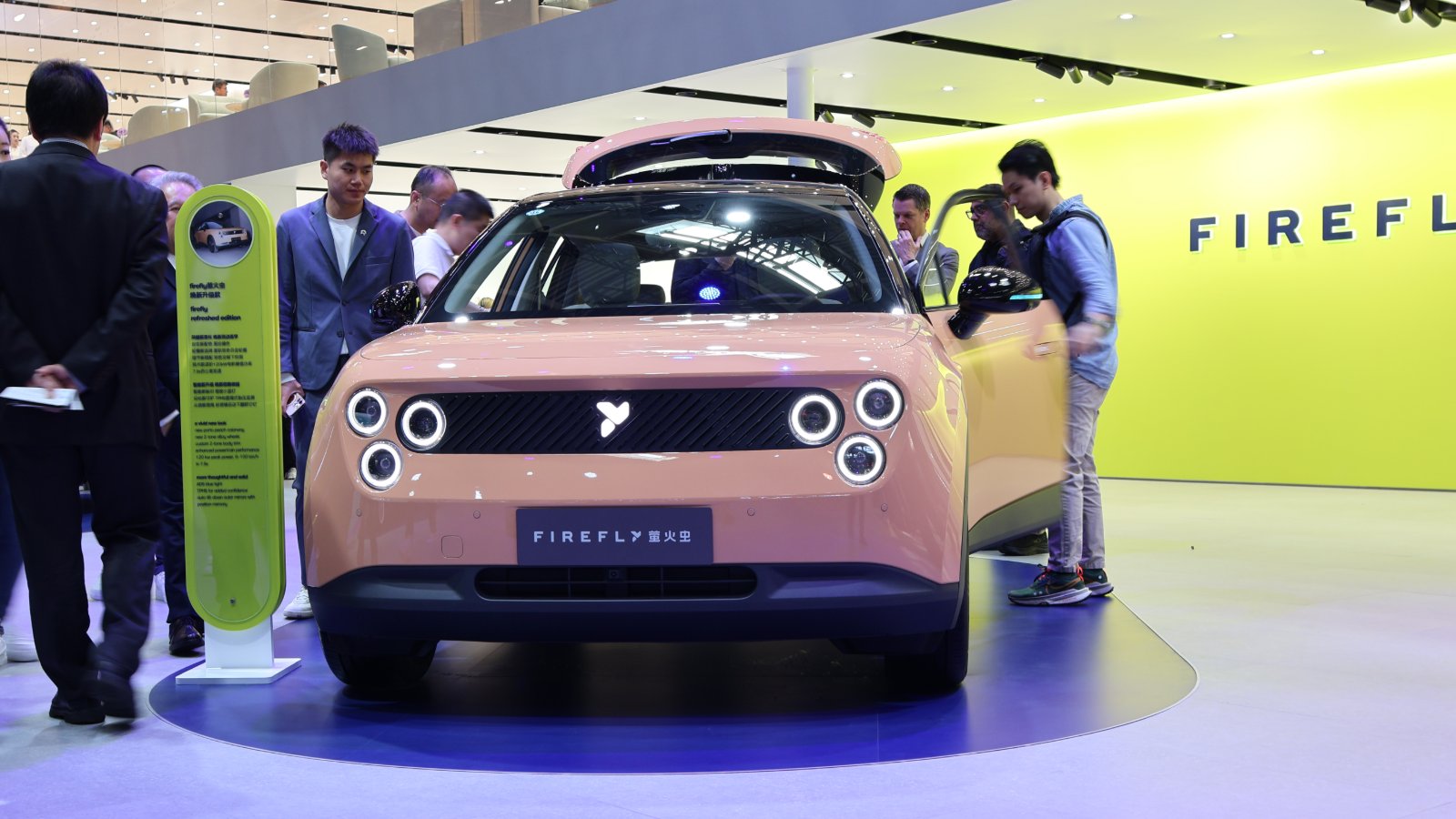 Front view of a pink Firefly EV with circular headlights on display at the Beijing Auto Show in April 2026.