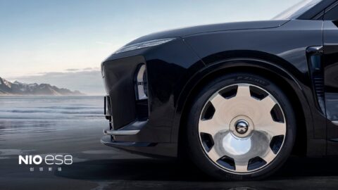 Close-up of a black Nio ES8's front quarter, highlighting the silver Lanyue wheel and Pirelli P Zero tire.