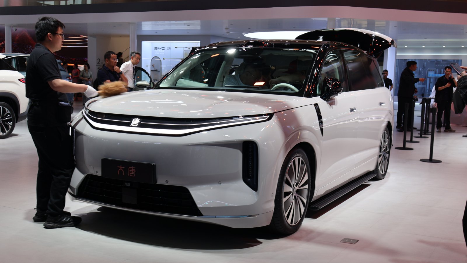 White BYD Da Tang EV with a black roof displayed at the Beijing Auto Show in April 2026, viewed from the front quarter.