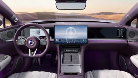 Interior of the Denza Z9S, showing the steering wheel, a 17.3-inch central control screen, and purple-and-white cabin trim.