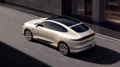 Silver IM Motors LS6 viewed from a rear three-quarter angle, showing its panoramic glass roof and full-width taillight.