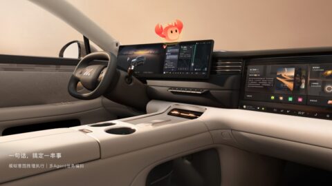 IM Motors LS6 cockpit featuring a wide dashboard display, a separate front passenger screen and a cream-colored center console.