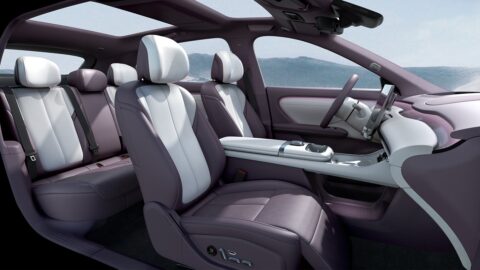 Changan Nevo Q06 interior showing the front and rear seats, center console and panoramic glass roof.