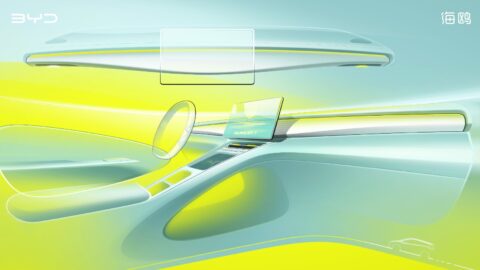 Interior design sketches of the second-generation BYD Seagull, showing the dashboard layout, floating central touchscreen and open storage space beneath the center console.