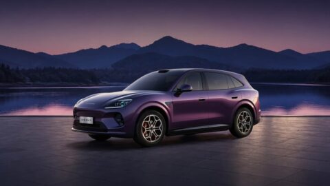 Purple Aistaland GX7 SUV shown from a front three-quarter angle beside a lake at dusk.