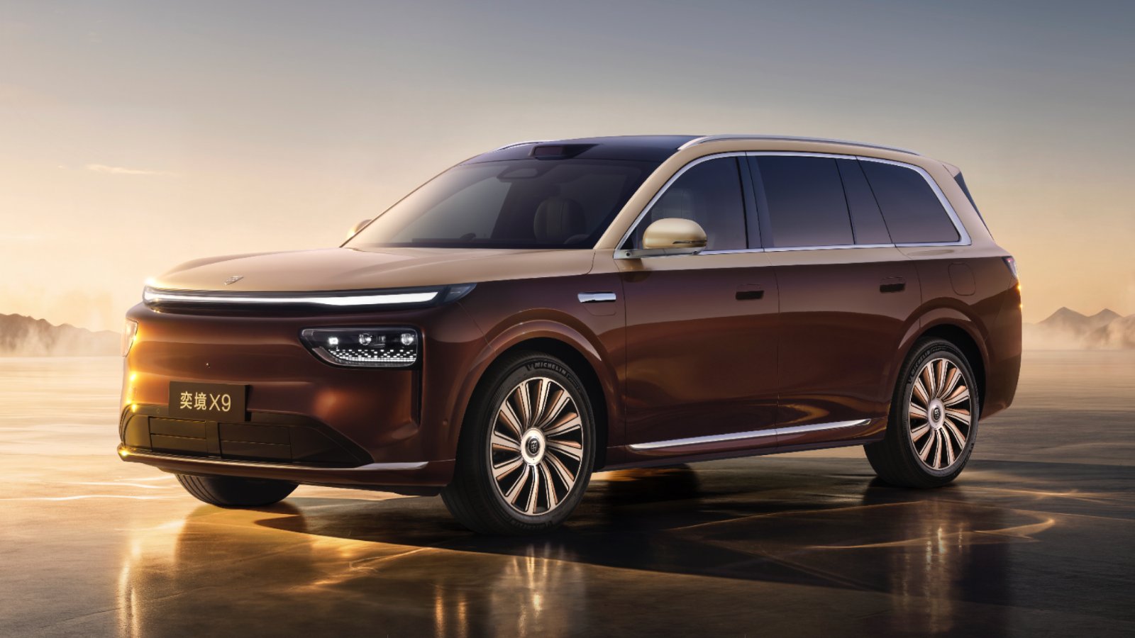 Front three-quarter view of a two-tone brown and gold Epicland X9 SUV with a full-width LED light strip and roof-mounted LiDAR.
