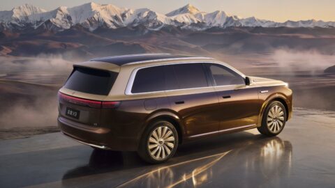 Rear three-quarter view of a two-tone brown and gold Epicland X9 SUV against a mountain backdrop.