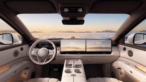 Epicland X9 front cabin with a light-colored steering wheel, dual dashboard displays and a center console.