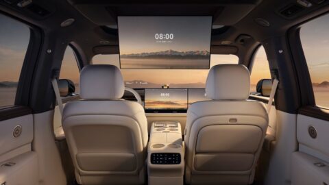 View from the Epicland X9's rear cabin, showing an overhead entertainment screen, front seatbacks and rear climate controls.