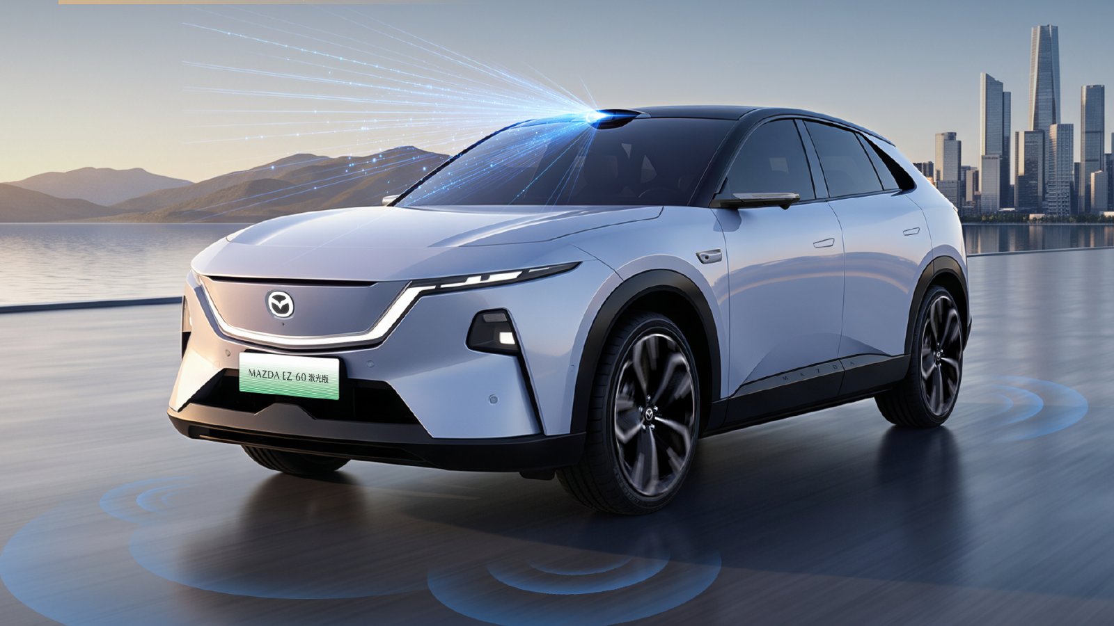 Front three-quarter view of a white Mazda EZ-60 LiDAR variant with a roof-mounted LiDAR sensor emitting blue light beams, parked on a waterfront road with mountains and a city skyline in the background. Blue rings on the ground illustrate the vehicle's sensor coverage.