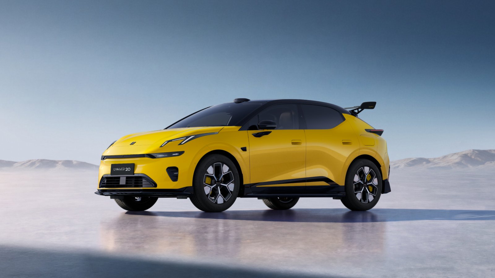 Yellow Lynk & Co 20 electric SUV viewed from the front three-quarter angle, featuring a black roof and rear spoiler.