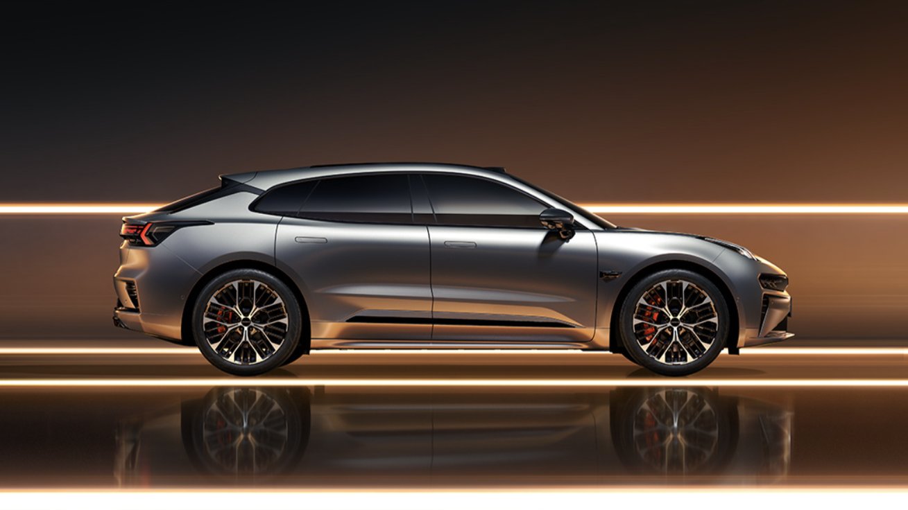 Side profile of a silver Zeekr 001 shooting brake against a dark background with orange light strips.