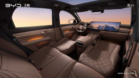 Amber Brown interior of the third-generation BYD Tang, showing quilted seats, a dual-screen dashboard and ambient lighting.