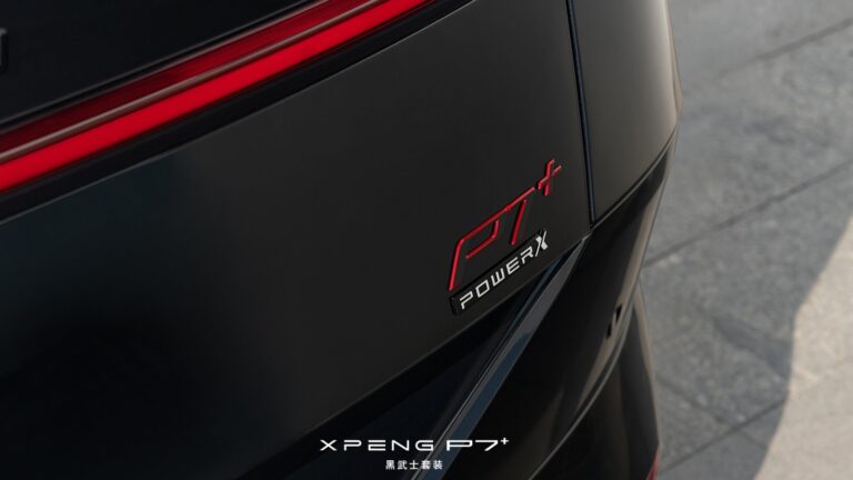 Close-up of the Xpeng P7+ Black Knight edition's rear decklid badge, with the "P7+" lettering in gloss red above a "Power X" script in white on a black panel.