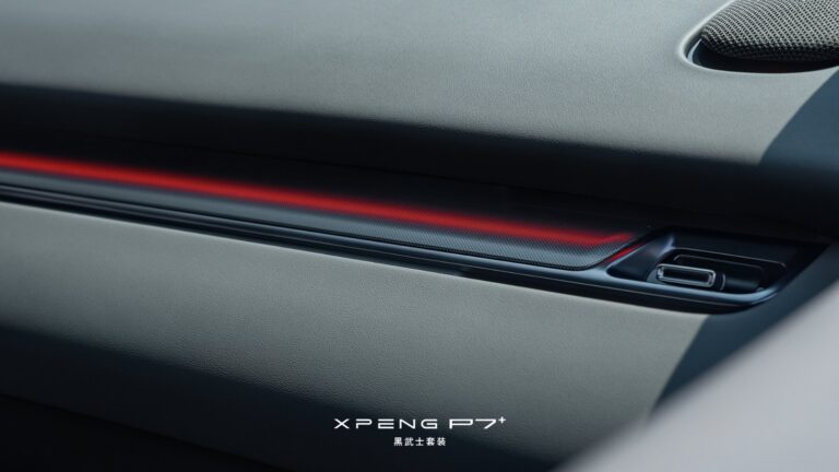 Detail of the Xpeng P7+ Black Knight package's door panel, showing grey leather trim, a perforated speaker grille and a red LED ambient light strip.