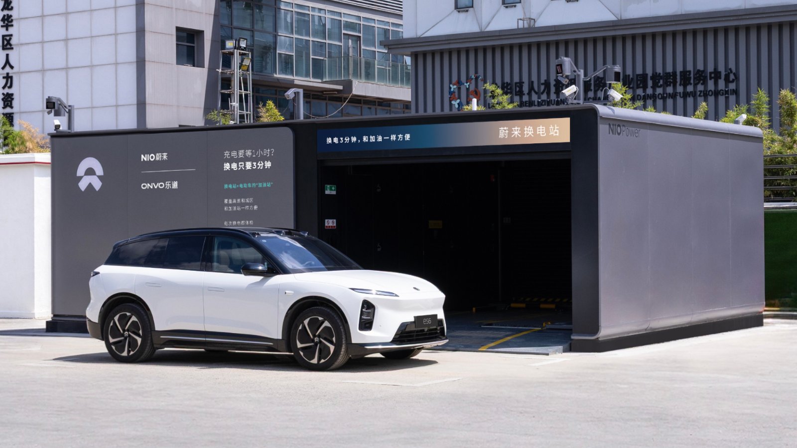 A white Nio ES6 outside a Nio battery swap station in Shenzhen, China.