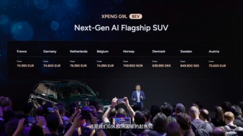Screen displaying Xpeng G9L starting prices across 8 European markets as attendees photograph the presentation.