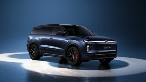 Front three-quarter view of a blue Volkswagen ID. ERA 8X SUV under studio lighting.