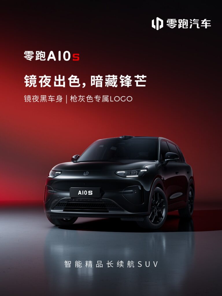 Front three-quarter view of the Leapmotor A10s with black bodywork, black wheels and illuminated headlights.