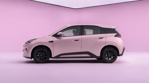 Side profile of a pink second-generation BYD Seagull with black wheels, dark window pillars and black lower body trim.