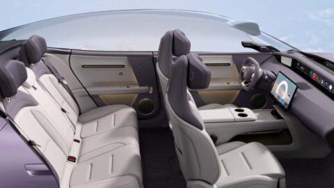 Cutaway view of the Avatr 06 cabin showing light-colored seats, a panoramic glass roof and a central touchscreen.