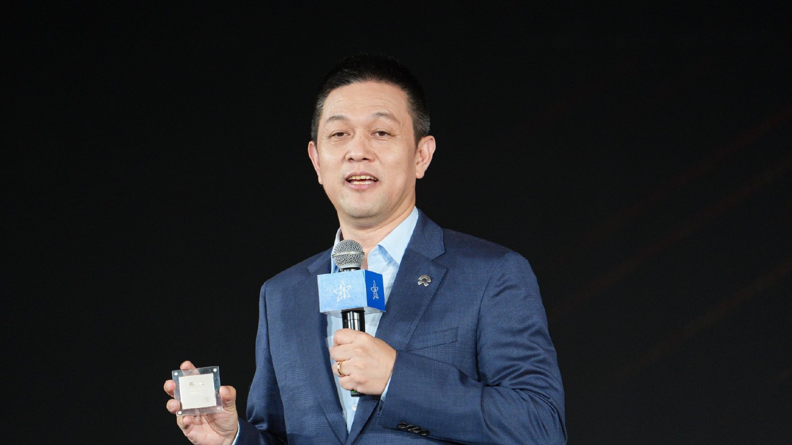 File photo shows William Li, founder, chairman, and CEO of Nio, demonstrating a Shenji autonomous driving chip developed in-house by Nio.