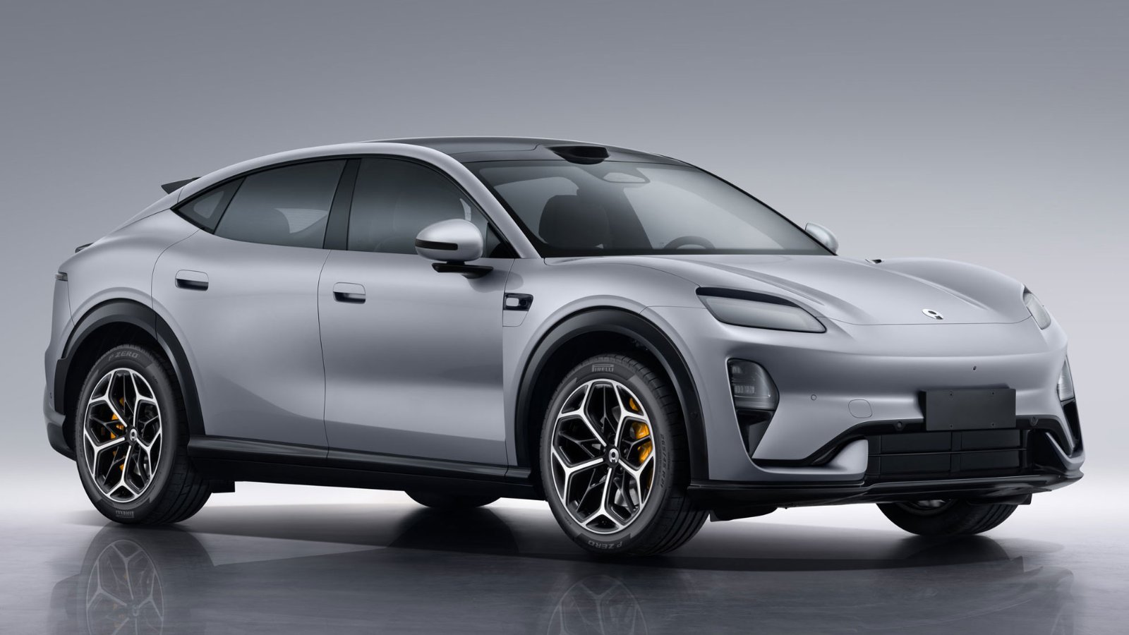 Silver Aiva ME7 electric SUV with a sloping roofline, black wheel arches and yellow brake calipers.