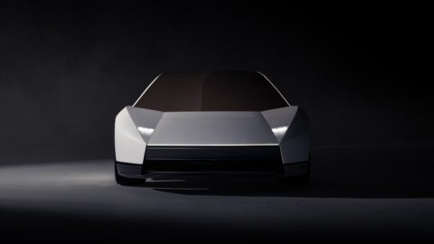 Front view of the Tesla Roadster with an angular nose and dark lower air intake.