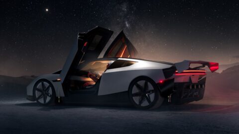 Rear three-quarter view of the Tesla Roadster with a raised door and rear wing beneath a starry sky.
