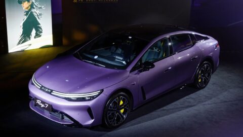 Purple GAC Aion Ray 7 on display indoors, viewed from above at a front three-quarter angle.